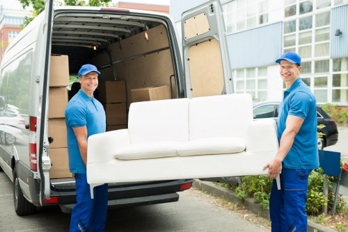 Man with a van loading furniture in a Dulwich residential street