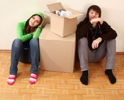 Removal professionals handling items during a property move