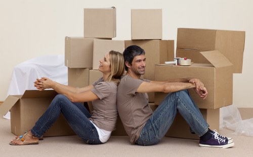 Professional movers handling furniture in a Dulwich property