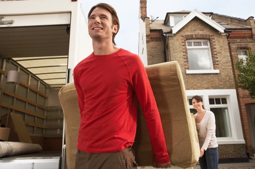 Packed moving boxes and furniture prepared for transport