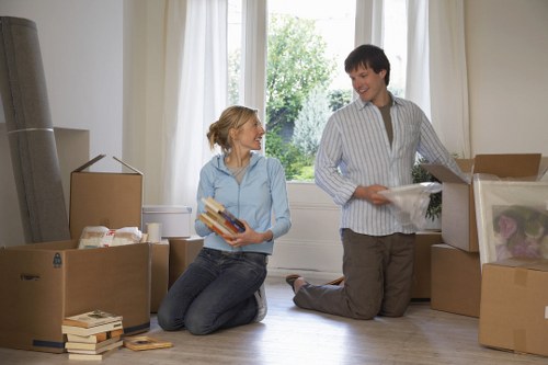 Movers loading items carefully outside a Dulwich property