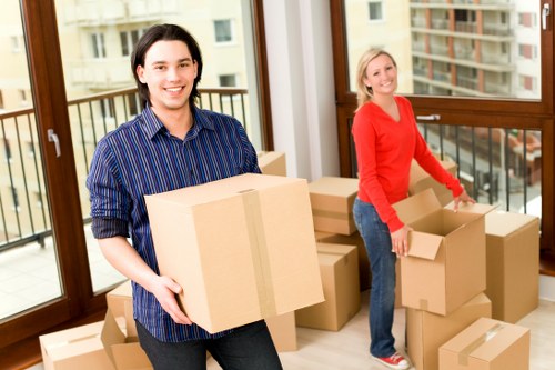 Professional movers carrying furniture during a house move in Dulwich